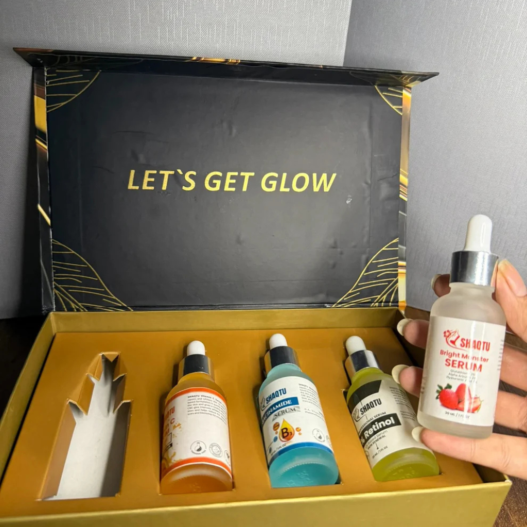 Complete Skin Transformation Kit 4 Professional Serums in a stylish box with four vibrant bottles of skincare serums.