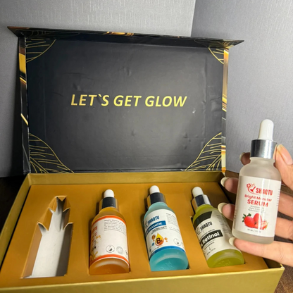 Complete Skin Transformation Kit 4 Professional Serums in a stylish box with four vibrant bottles of skincare serums.